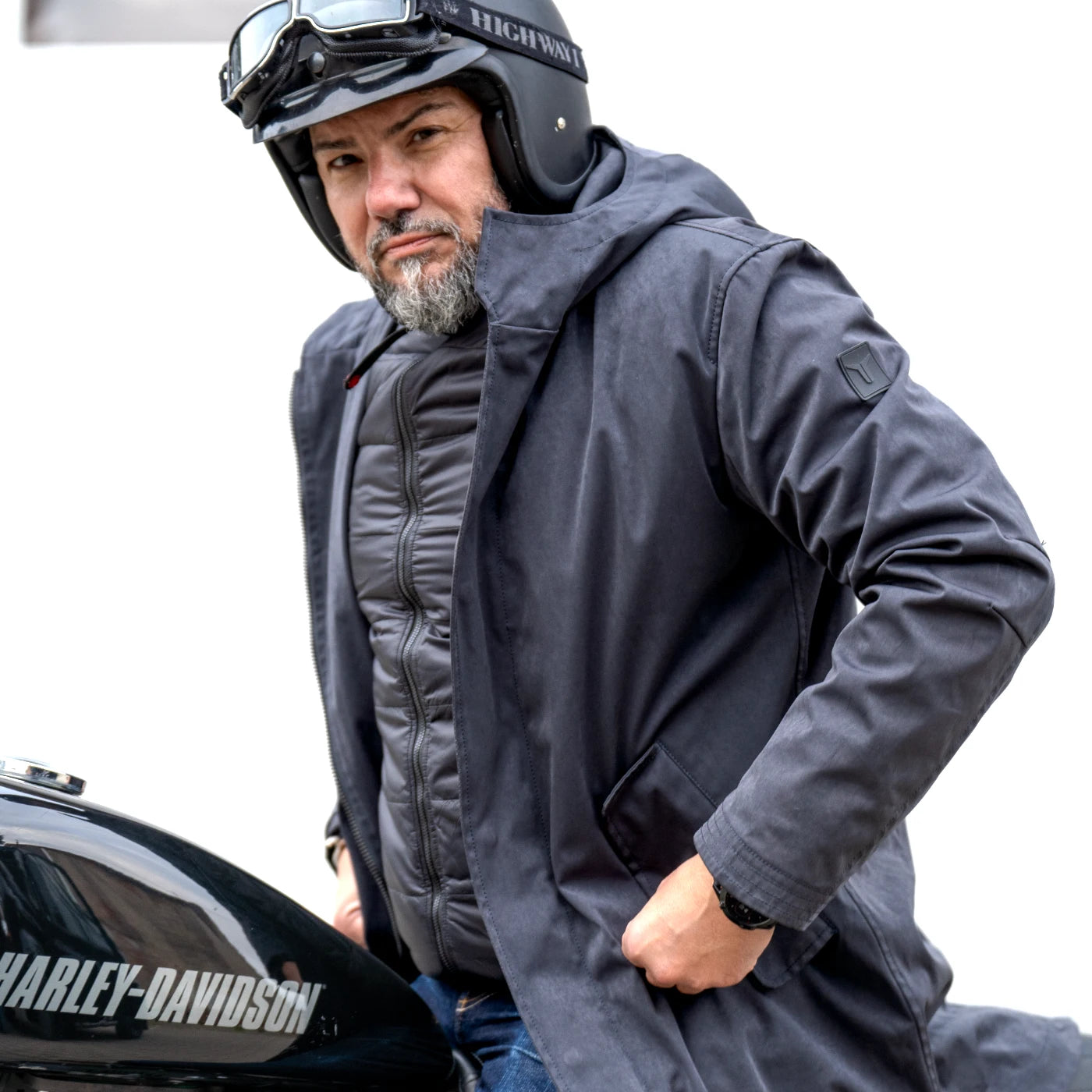 Close-up of the CADUFF 2-in-1 Winter Parka showing ECO DOWN insulation and stretch side panel; warmth rating CLO 2.74 (~800 fill-power).