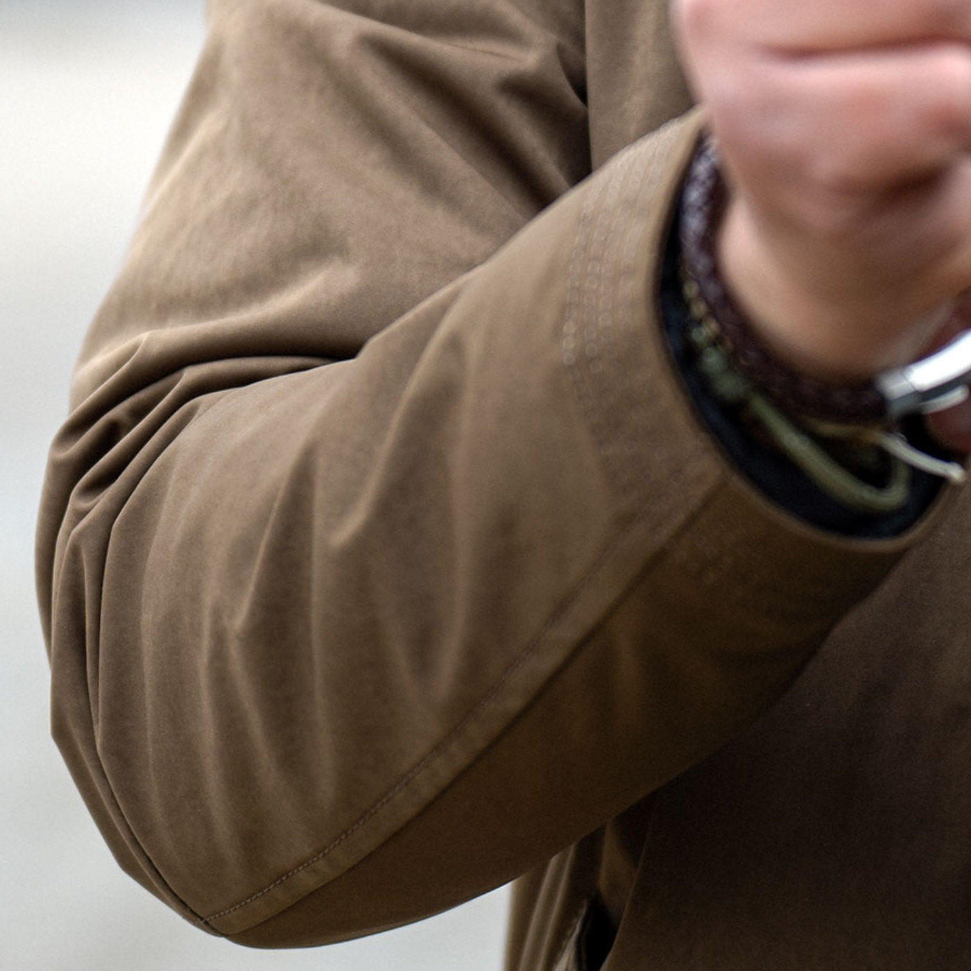 Sleeve close-up of the Beech Japanese high-density double-knit on the CADUFF Shirase 2-in-1 Winter Parka (≈11 oz / 300 g/m²), showing compact, shrink-processed structure for durability and weather resistance.