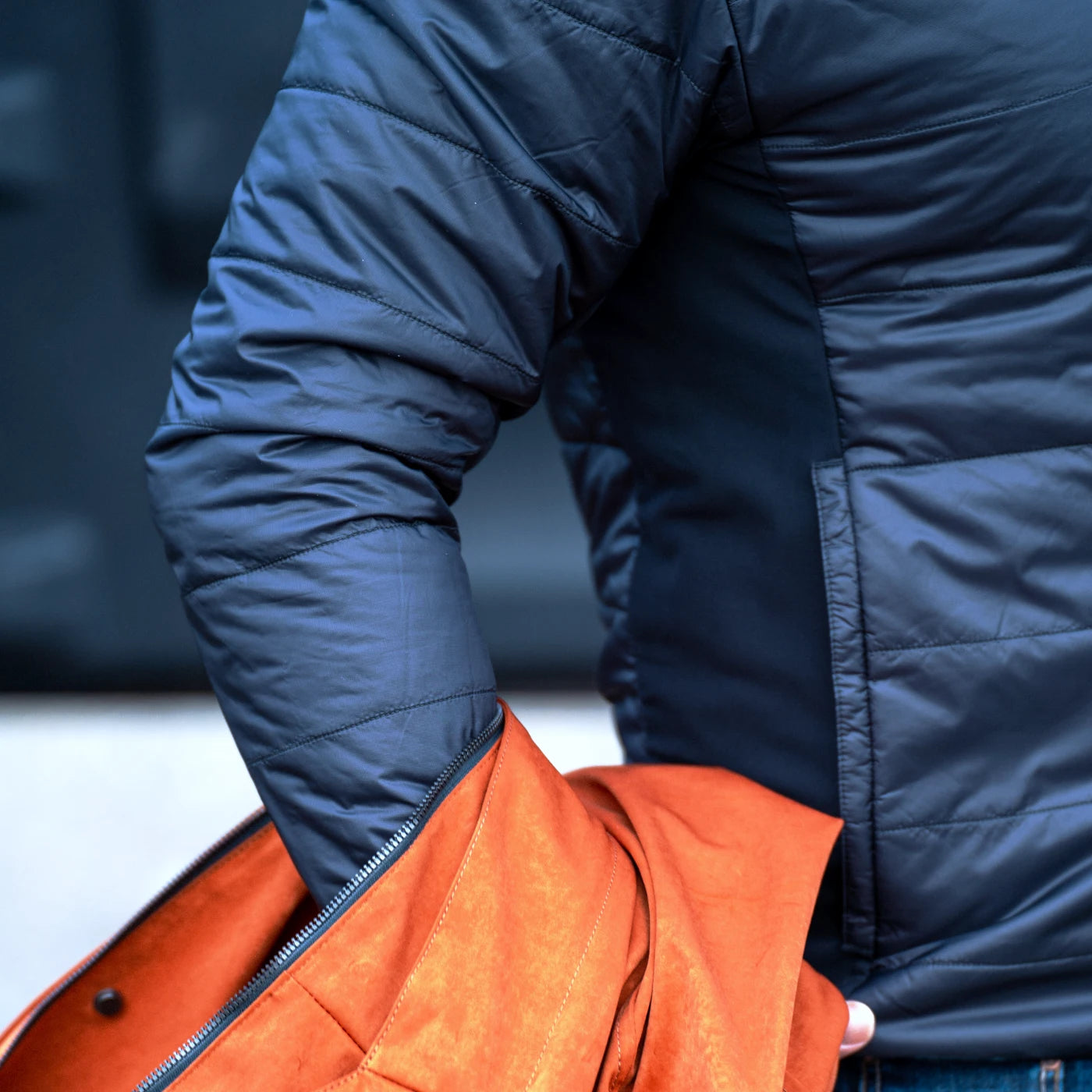 Ginger CADUFF 2-in-1 Winter Parka — removable ECO DOWN liner shown with stretch side panel; packs into its own pocket for travel.