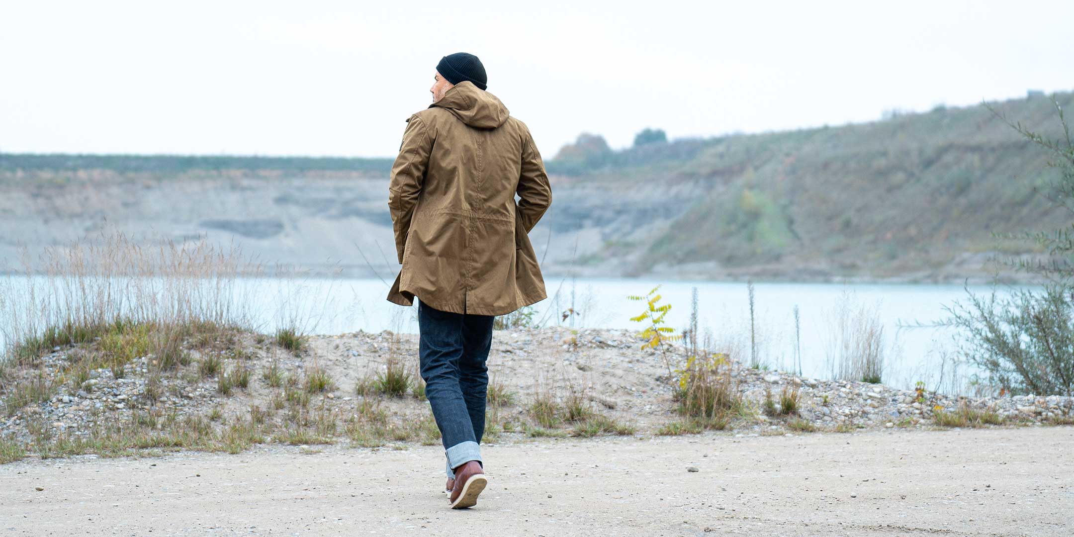 CADUFF Japanese Double-Knit 2-in-1 Winter Parka — Beech, back view while walking outdoors; water-repellent and wind-resistant; removable ECO DOWN liner.