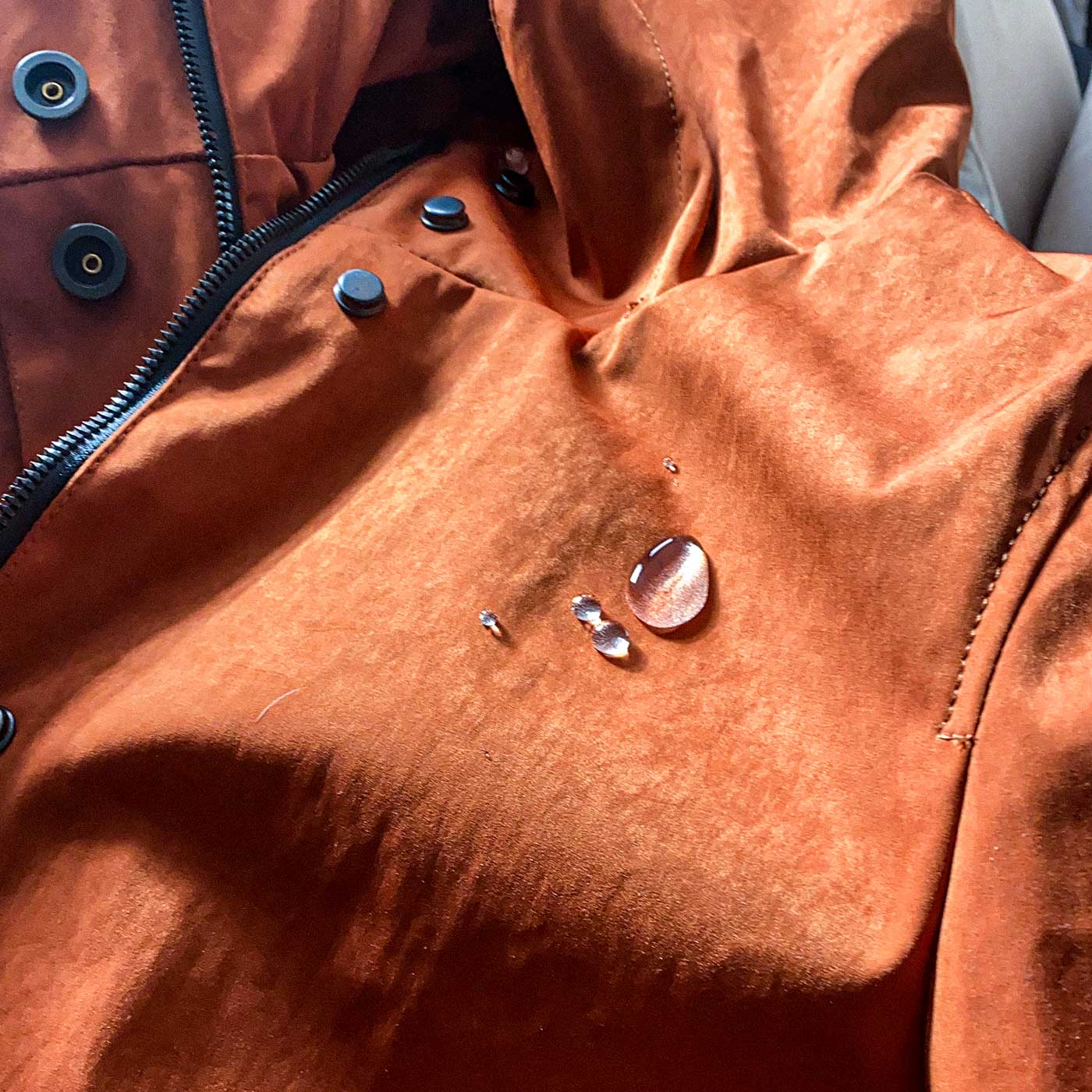 Japanese high-density double-knit on the CADUFF Shirase 2-in-1 Winter Parka showing water-repellent beads and breathable construction (C6 finish).